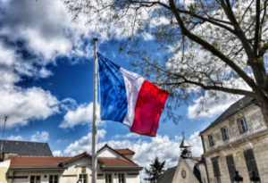 Picture of a blue sky and a French flag